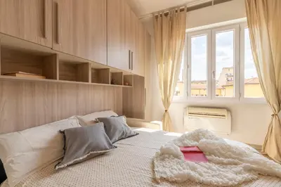 Letto o letti in una camera di Urban Nest at Leopolda & Fortezza