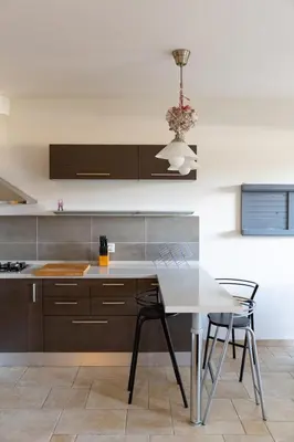 Cucina o angolo cottura di Tranquil & Modern Apartment outside ZTL