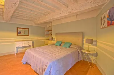 Letto o letti in una camera di Montegufoni by PosarelliVillas