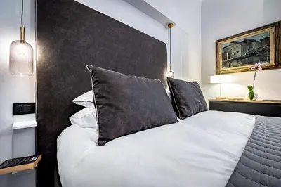 Letto o letti in una camera di Suite Nobellina Florence