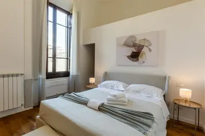 Letto o letti in una camera di GuestHost - Giardino della Fortezza Chic Apartment