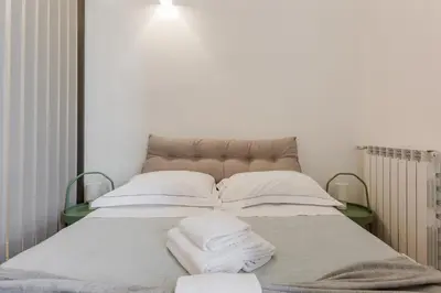 Letto o letti in una camera di GuestHost - Giardino della Fortezza Chic Apartment