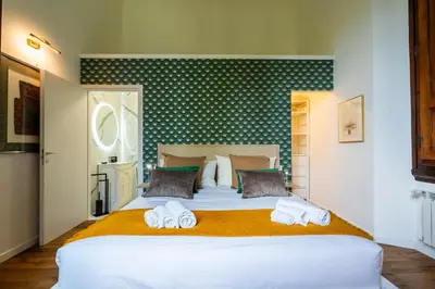 Letto o letti in una camera di La Dimora Moderna in Palazzo Storico - Con Suite Privata