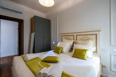 Letto o letti in una camera di La Dimora Moderna in Palazzo Storico - Con Suite Privata