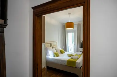 Letto o letti in una camera di La Dimora Moderna in Palazzo Storico - Con Suite Privata