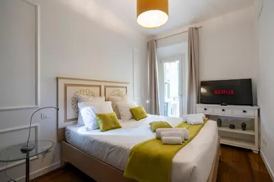 Letto o letti in una camera di La Dimora Moderna in Palazzo Storico - Con Suite Privata