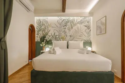 Letto o letti in una camera di Campuccio Suite in Oltrarno, Florence