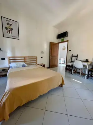 Letto o letti in una camera di Appartamento in San Donato Novoli a poca distanza dalla Tranvia