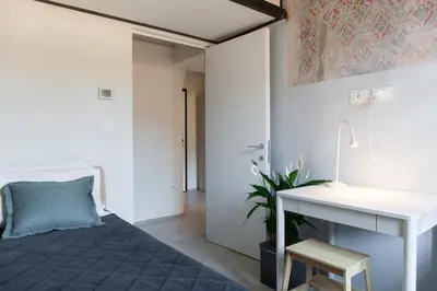Letto o letti in una camera di Bright Terrace Loft in Florence Center