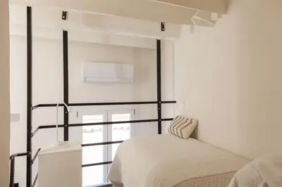 Letto o letti in una camera di Bright Terrace Loft in Florence Center