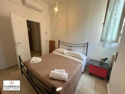 Letto o letti in una camera di La Casina di Vingone by Florence Sweet Homes srl