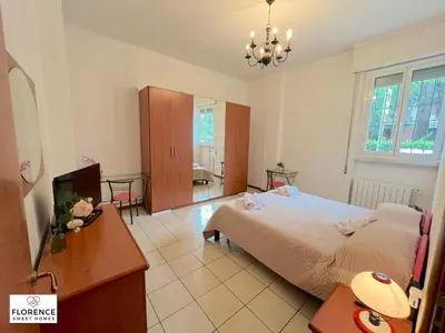 Letto o letti in una camera di La Casina di Vingone by Florence Sweet Homes srl