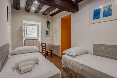 Letto o letti in una camera di Casa dei Leoni - Dolcevita Holiday