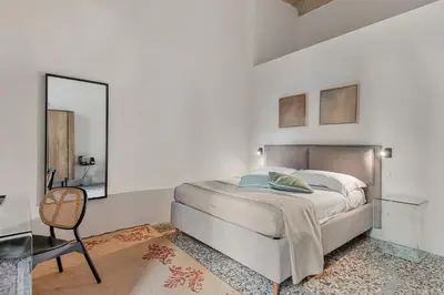Letto o letti in una camera di Three Rooms D'AZEGLIO 12