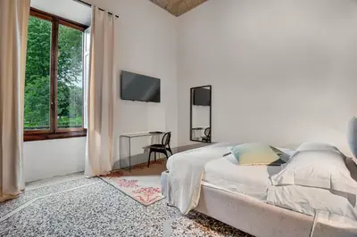 Letto o letti in una camera di Three Rooms D'AZEGLIO 12