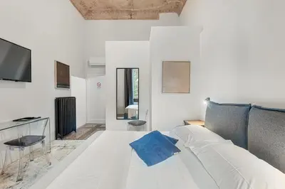 Letto o letti in una camera di Three Rooms D'AZEGLIO 12