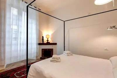 Letto o letti in una camera di San Gallo Apartment by Mamo Florence