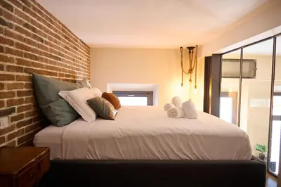 Letto o letti in una camera di Ponte alla Vittoria Urban Garden Loft
