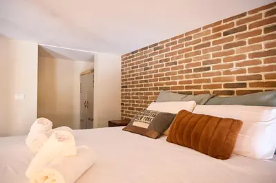 Letto o letti in una camera di Ponte alla Vittoria Urban Garden Loft
