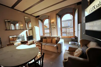Area soggiorno di Acacia Firenze Apartments Cumino-Cannella-Curry
