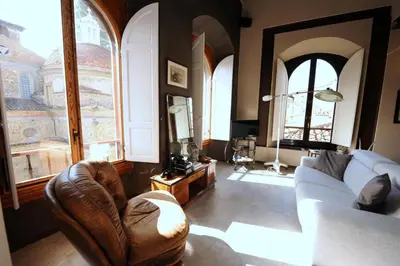 Area soggiorno di Acacia Firenze Apartments Cumino-Cannella-Curry