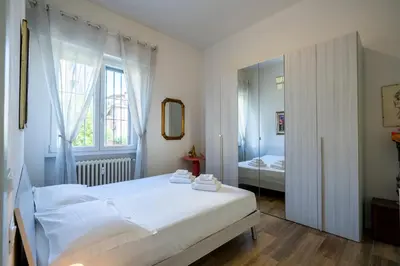 Letto o letti in una camera di Isolotto - Appartamento Affitto Firenze by Hôtea
