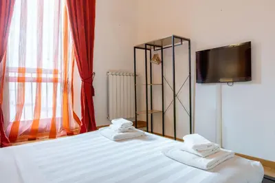 Letto o letti in una camera di Sant'Ambrogio Apartments - Michelangelo