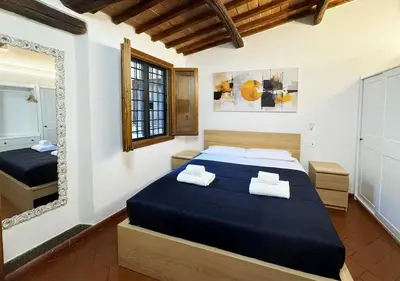 Letto o letti in una camera di Casa di Ciapa - Boutique Apt nel cuore di Firenze