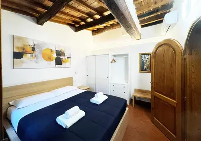 Letto o letti in una camera di Casa di Ciapa - Boutique Apt nel cuore di Firenze