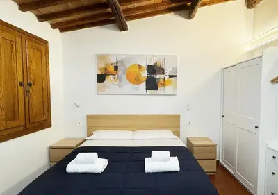 Letto o letti in una camera di Casa di Ciapa - Boutique Apt nel cuore di Firenze