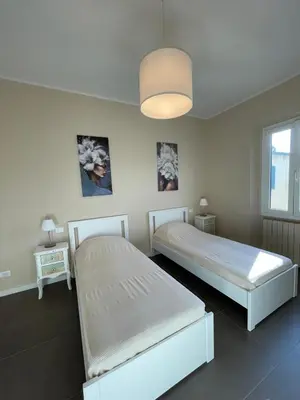 Letto o letti in una camera di La Loggetta Apartment di Leonardo