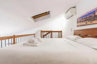 Letto o letti in una camera di view of the Arno Window on the Arno VII wifi, ac
