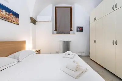 Letto o letti in una camera di I Santa Croce I Conciatori Prestige Home Apartment