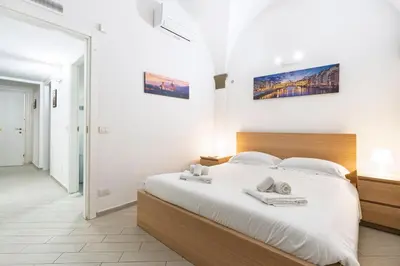 Letto o letti in una camera di I Santa Croce I Conciatori Prestige Home Apartment