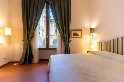 Letto o letti in una camera di La Casa del Ghiberti B&B