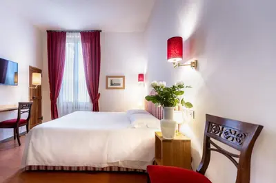 Letto o letti in una camera di La Casa del Ghiberti B&B