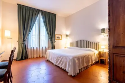 Letto o letti in una camera di La Casa del Ghiberti B&B