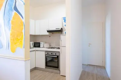 Cucina o angolo cottura di Cozy and Bright Flat - Top Floor with Elevator