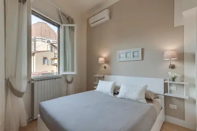 Letto o letti in una camera di San Lorenzo Dome Apartment