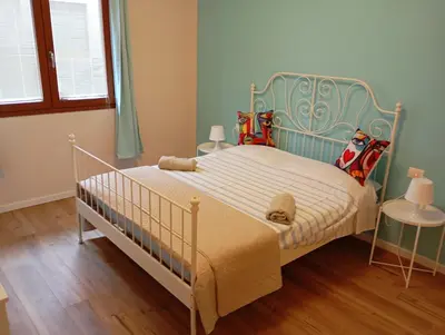 Letto o letti in una camera di Casa Firenze