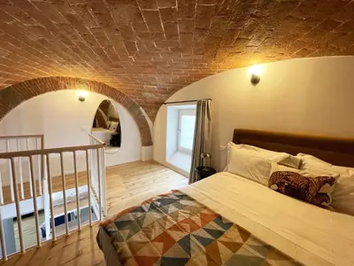 Letto o letti in una camera di Cararina home