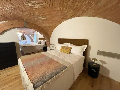 Letto o letti in una camera di Cararina home