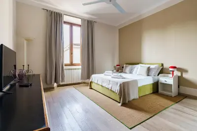 Letto o letti in una camera di Poggio Imperiale Home By San Firenze Collection