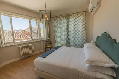 Letto o letti in una camera di Arco Apartment via Dell'Oriuolo 1 managed by Antica Torre di Via Tornabuoni