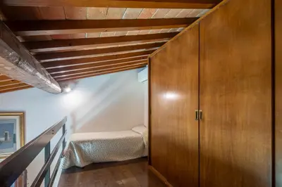 Letto o letti in una camera di Villa Oliveta
