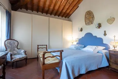 Letto o letti in una camera di Villa Oliveta