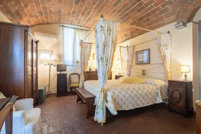 Letto o letti in una camera di Villa Oliveta