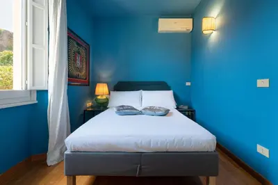 Letto o letti in una camera di Villa Angela