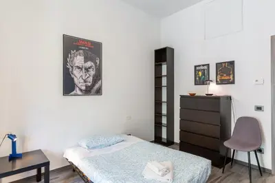 Letto o letti in una camera di GuestHost - Lights, Camera, Action! - Florence Apt