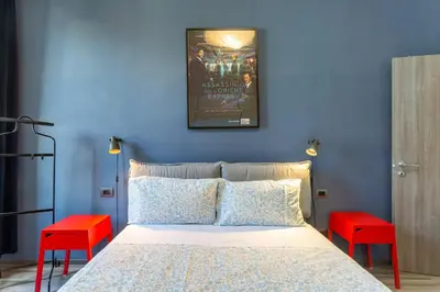 Letto o letti in una camera di GuestHost - Lights, Camera, Action! - Florence Apt